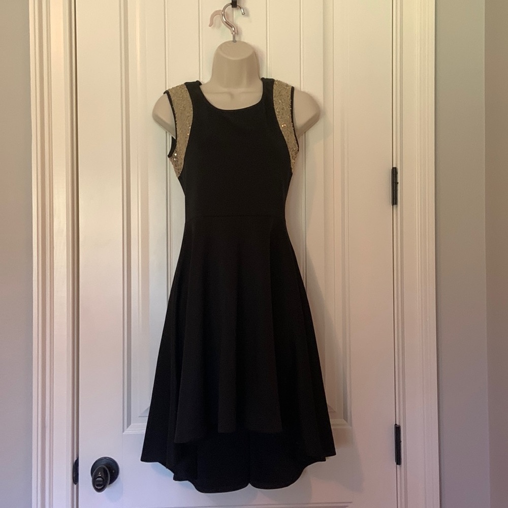 Black high low sleeveless dress with champagne sequin accent. Size S.